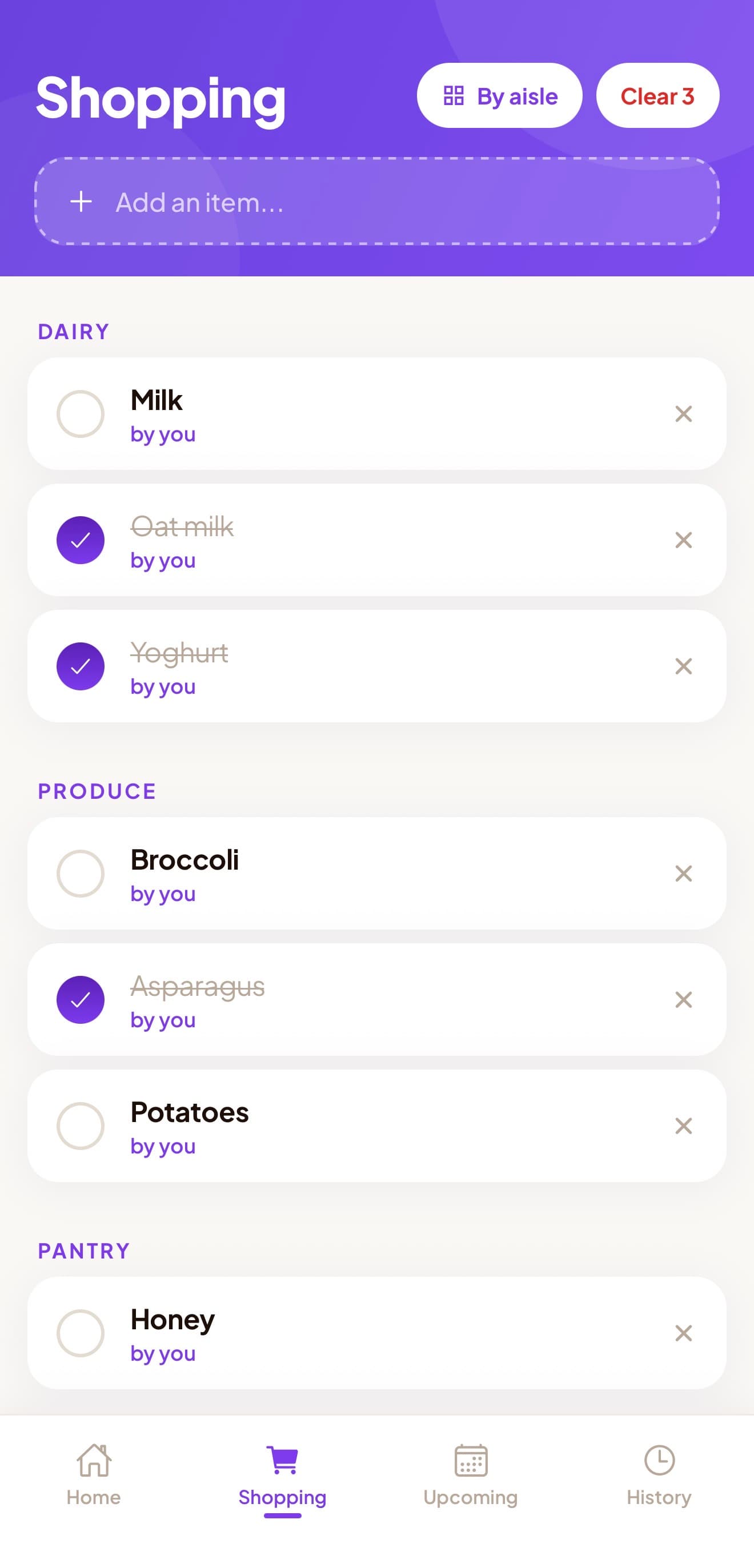 The Carry shopping list grouped into Dairy, Produce and Pantry sections, with several items already checked off